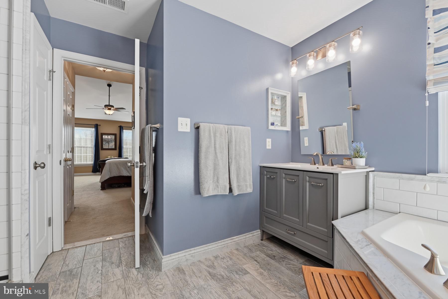 11206 Poplar Grove Court Laurel, MD 20708 - Photo 26 of 67 a kitchen with a refrigerator and a sink