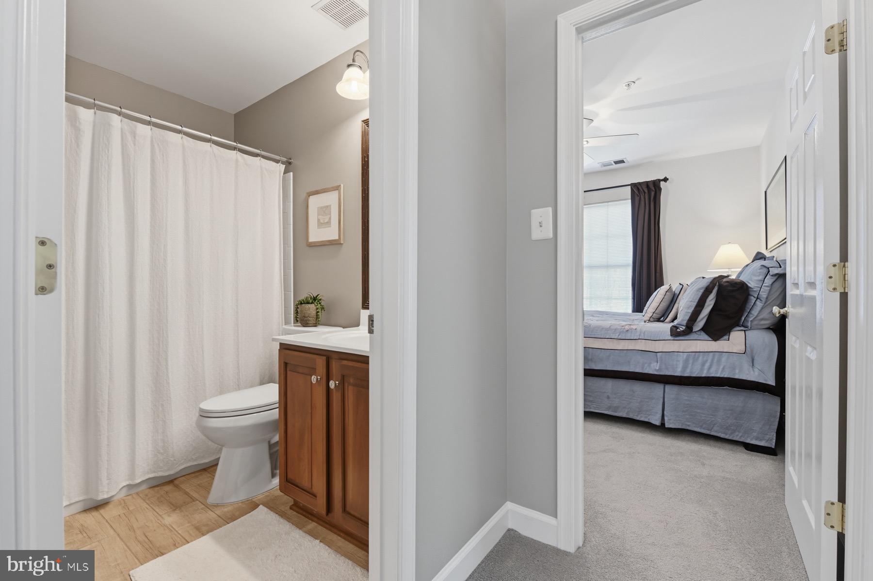 11206 Poplar Grove Court Laurel, MD 20708 - Photo 28 of 67 a en suite bathroom with a toilet sink and mirror