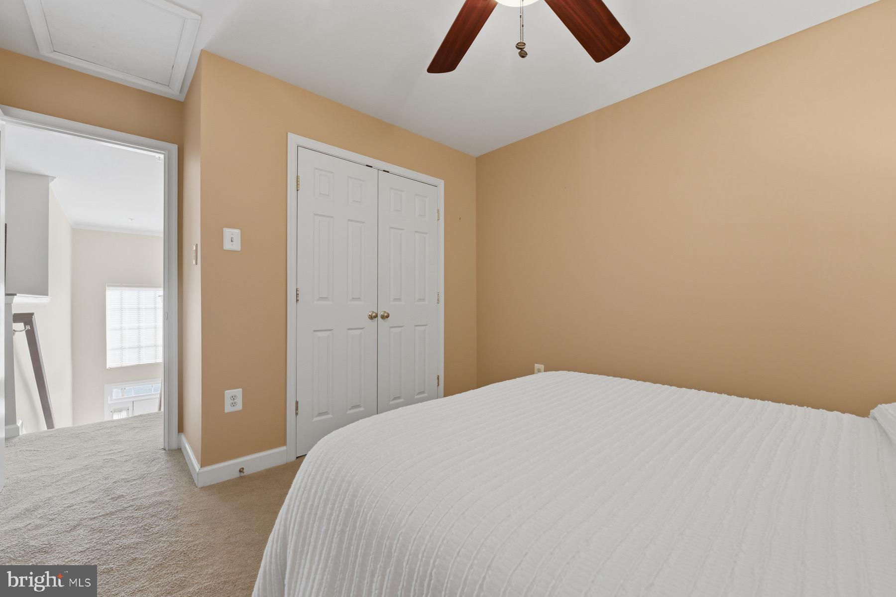 11206 Poplar Grove Court Laurel, MD 20708 - Photo 34 of 67 a bedroom with a bed and a chandelier