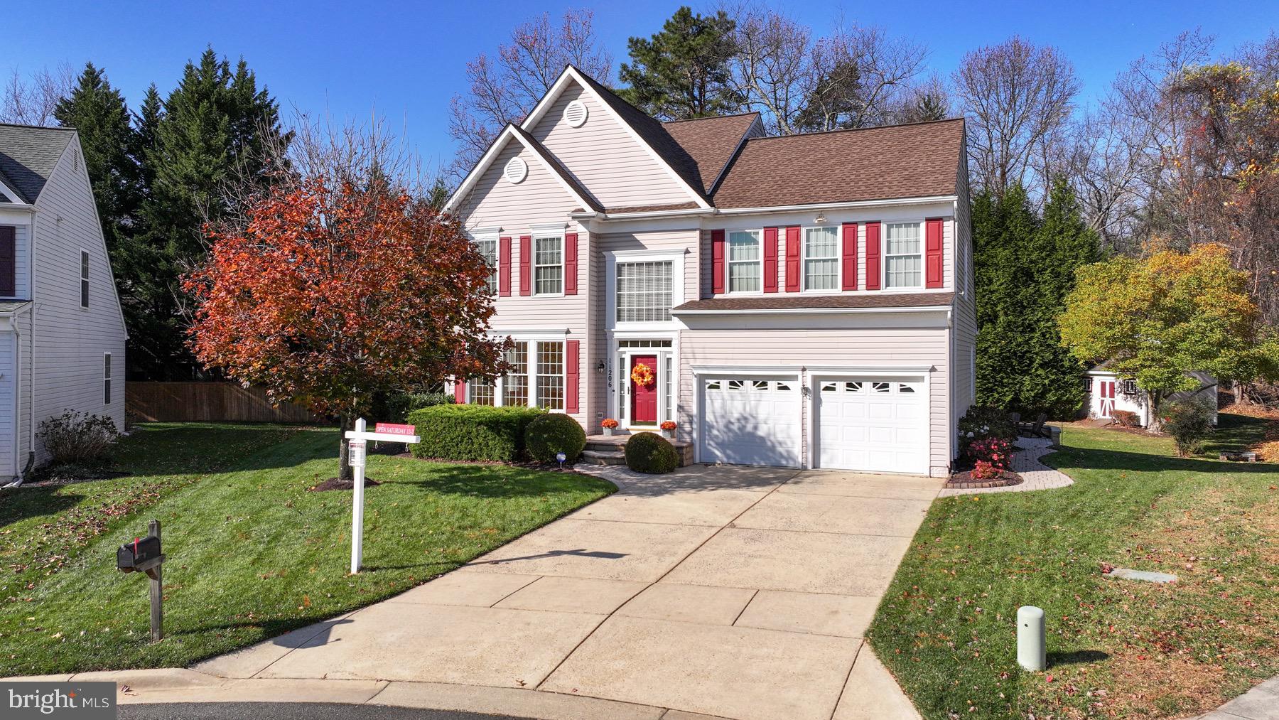 11206 Poplar Grove Court Laurel, MD 20708 - Photo 52 of 67 front view of a house with a yard