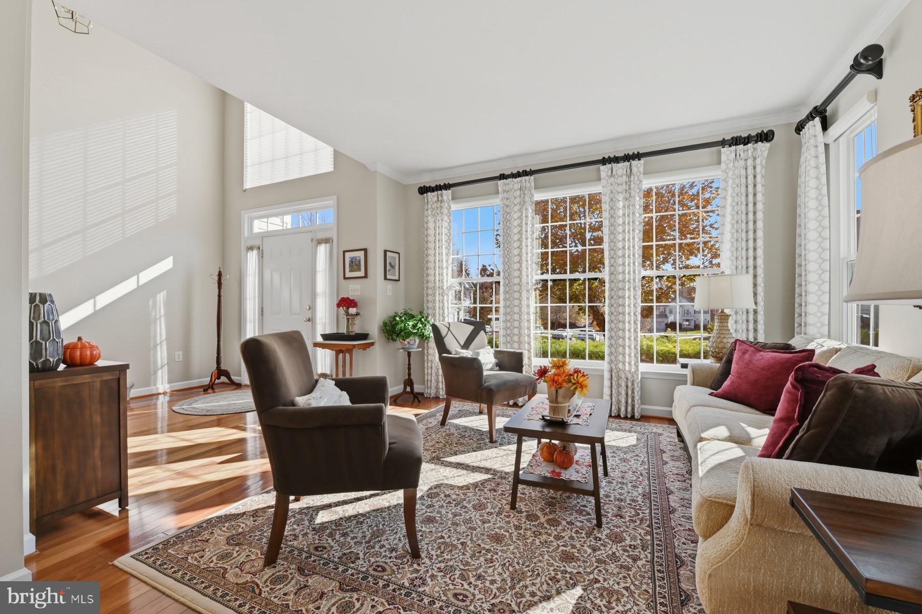 11206 Poplar Grove Court Laurel, MD 20708 - Photo 7 of 67 a living room with furniture and a large window