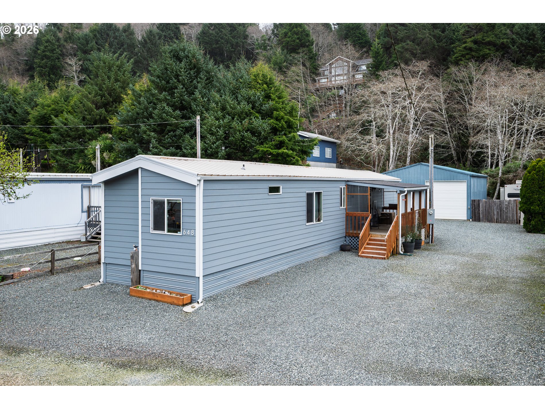 648 South Easy Street Rockaway Beach, OR 97136 - Photo 1 of 35 a view of a house with backyard