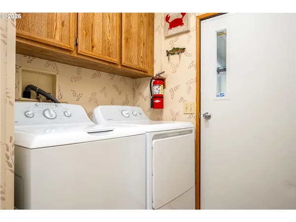 a utility room with dryer and washer