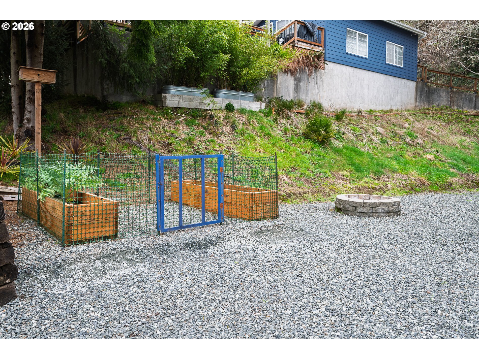 648 South Easy Street Rockaway Beach, OR 97136 - Photo 22 of 35 a backyard of a house with lots of green space