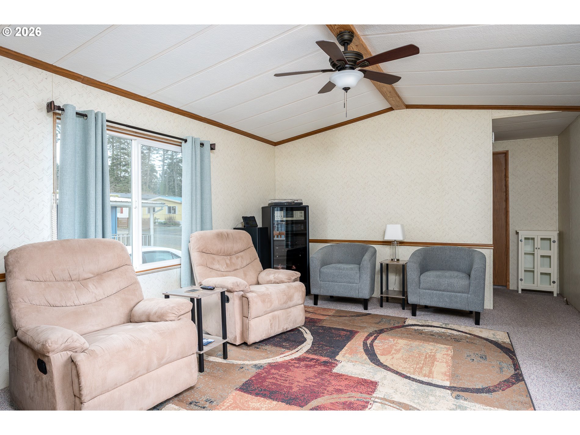 648 South Easy Street Rockaway Beach, OR 97136 - Photo 34 of 35 a living room with furniture and a window