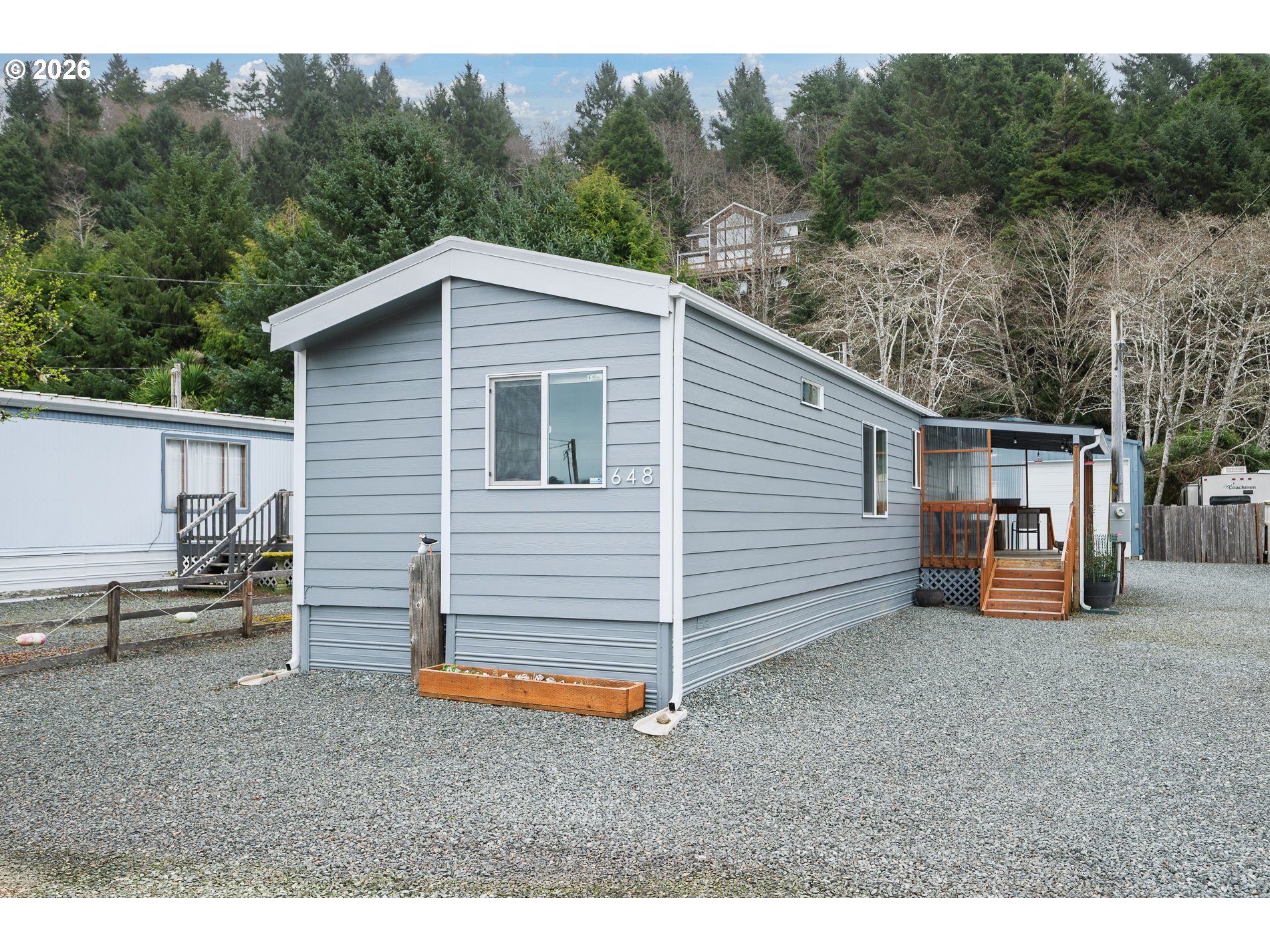 648 South Easy Street Rockaway Beach, OR 97136 - Photo 5 of 35 a view of a house with a backyard