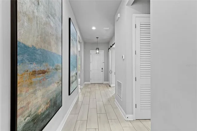 a view of a bathroom from the hallway