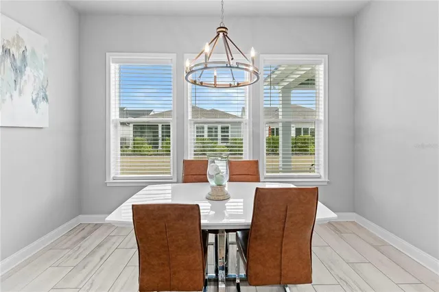 a view of a dining room with furniture window and outside view