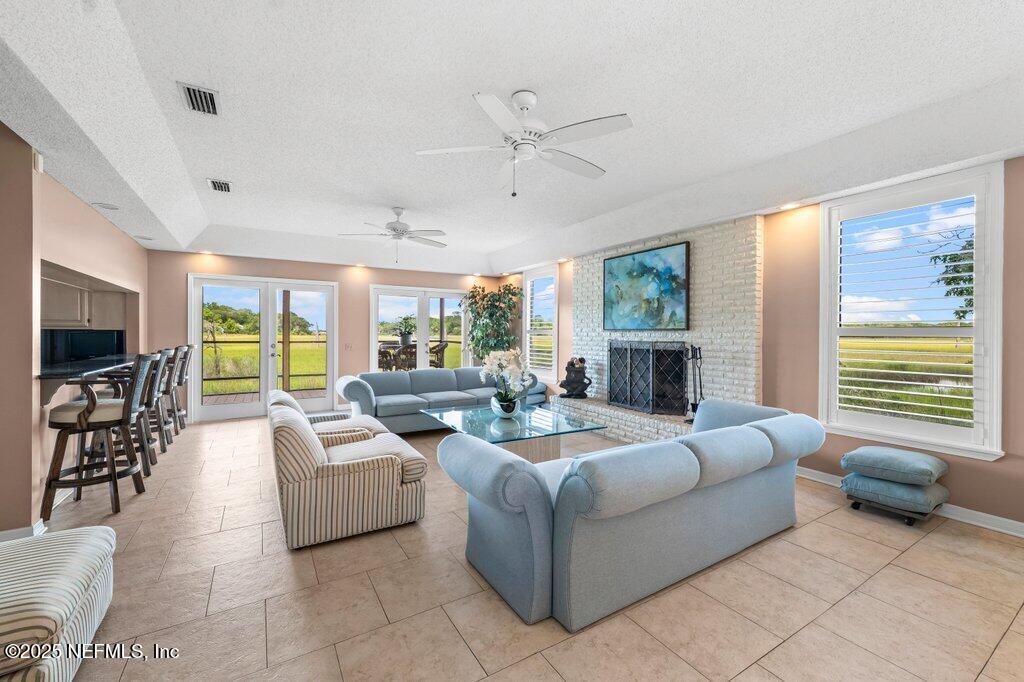 2010 Shadow Lane Neptune Beach, FL 32266 - Photo 13 of 61 a living room with fireplace furniture and a large window