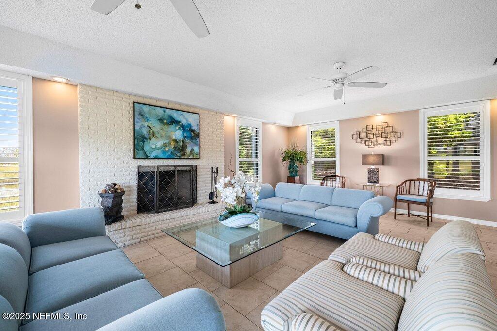 2010 Shadow Lane Neptune Beach, FL 32266 - Photo 15 of 61 a living room with furniture and a fireplace