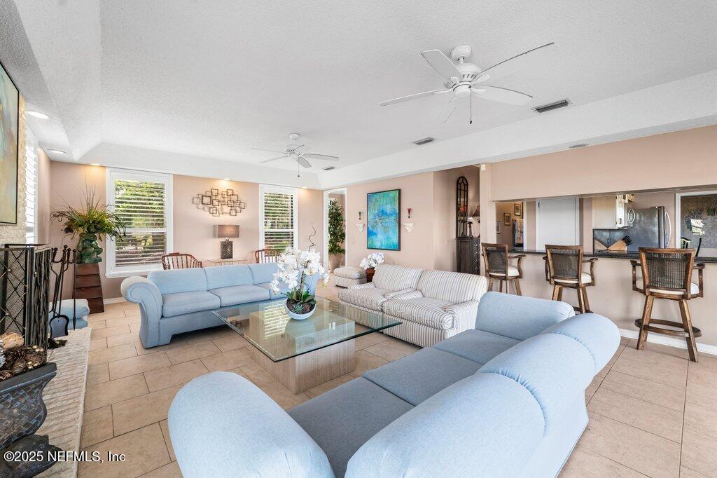 2010 Shadow Lane Neptune Beach, FL 32266 - Photo 16 of 61 a living room with furniture and a large window