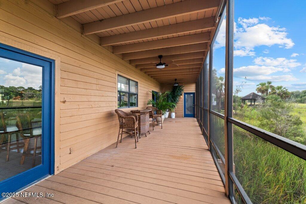 2010 Shadow Lane Neptune Beach, FL 32266 - Photo 21 of 61 a view of a patio with dining table and chairs