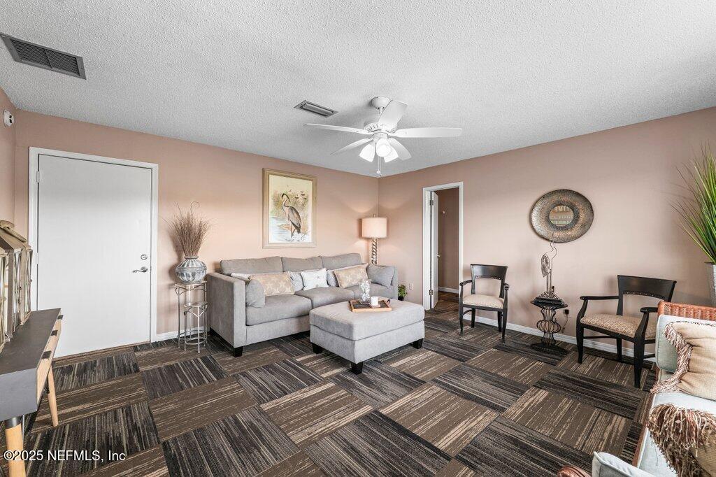 2010 Shadow Lane Neptune Beach, FL 32266 - Photo 27 of 61 a living room with furniture and a large window