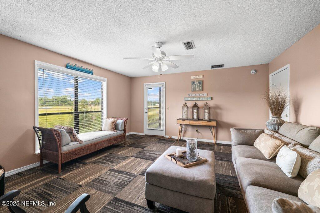 2010 Shadow Lane Neptune Beach, FL 32266 - Photo 28 of 61 a living room with furniture and a large window