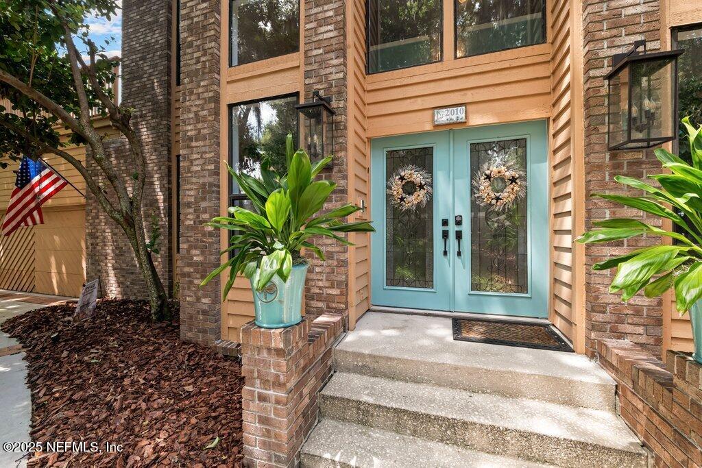 2010 Shadow Lane Neptune Beach, FL 32266 - Photo 3 of 61 a view of a entryway door front of house