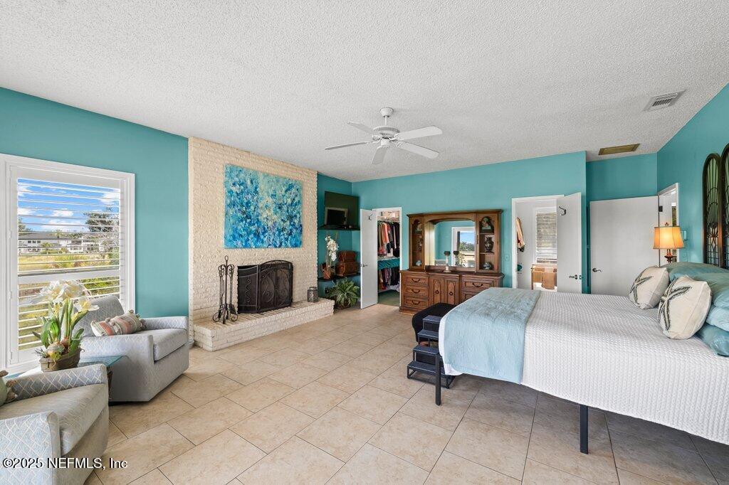 2010 Shadow Lane Neptune Beach, FL 32266 - Photo 33 of 61 a bedroom with a large bed couch and a window