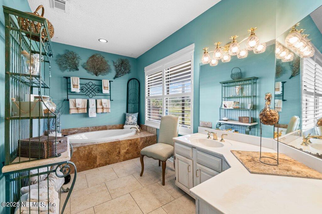 2010 Shadow Lane Neptune Beach, FL 32266 - Photo 34 of 61 a living room with furniture and a chandelier