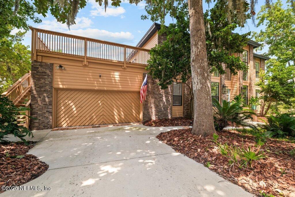 2010 Shadow Lane Neptune Beach, FL 32266 - Photo 57 of 61 a view of a house with a door