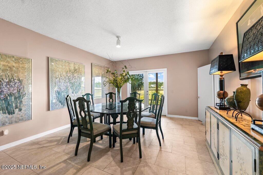 2010 Shadow Lane Neptune Beach, FL 32266 - Photo 6 of 61 a view of a dining room with furniture and chandelier