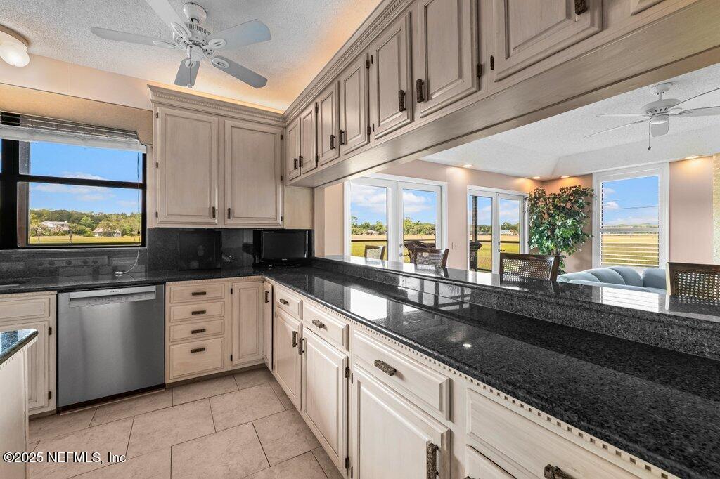 2010 Shadow Lane Neptune Beach, FL 32266 - Photo 8 of 61 a large kitchen with stainless steel appliances granite countertop a sink and cabinets