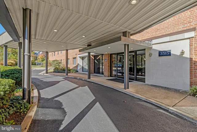 a spacious bathroom with a granite countertop sink and shower