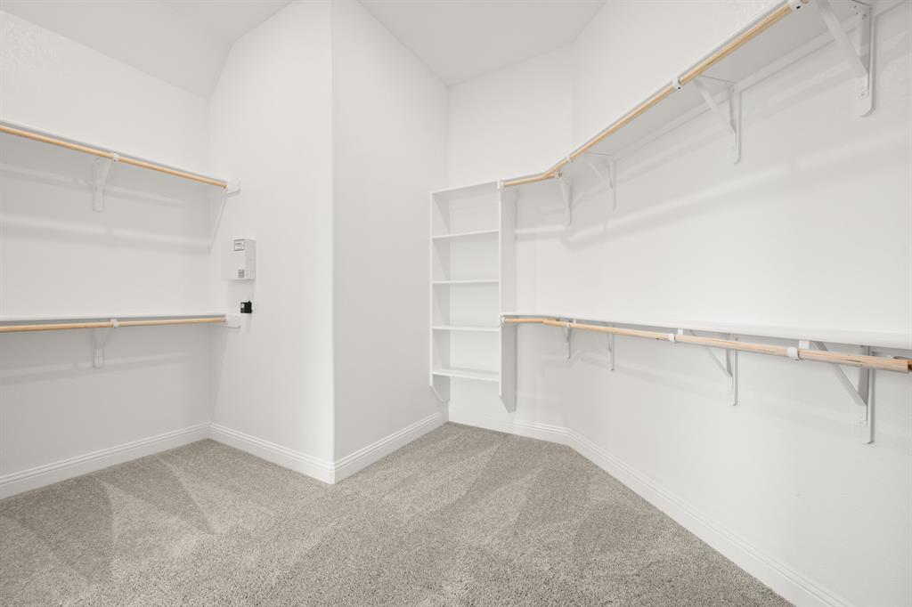27 Old Crow Road Joshua, TX 76058 - Photo 25 of 35 a view of walk in closet with empty racks