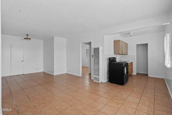 a kitchen with a stove and a microwave