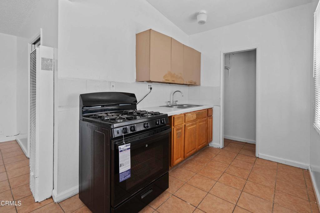 5441 Perkins Road Oxnard, CA 93033 - Photo 21 of 39 a kitchen with a stove and a microwave