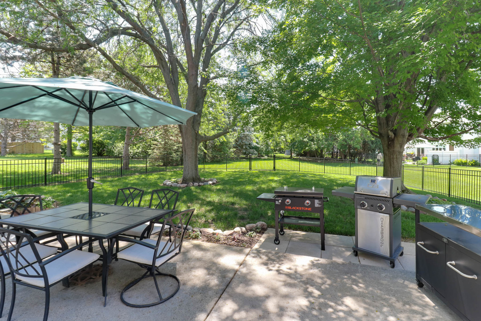 3203 Eagle Crest Road Bloomington, IL 61704 - Photo 47 of 52 a view of a table and chairs under an umbrella