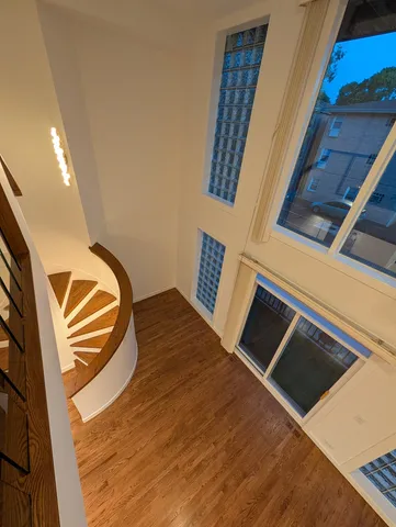 a bathroom with a sink mirror vanity and toilet