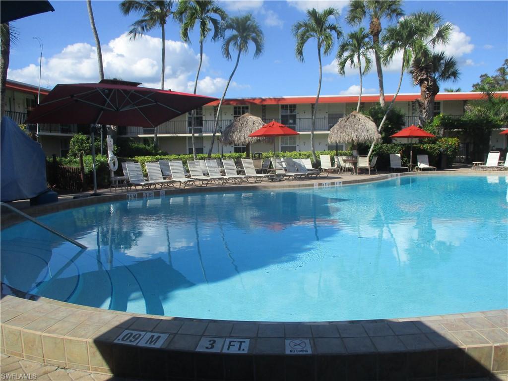 2555 9th Street North, Unit 131 Naples, FL 34103 - Photo 11 of 17 a view of swimming pool with a patio