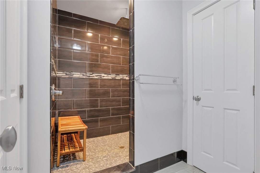 1890 Baltimore Road Northwest Lancaster, OH 43130 - Photo 33 of 50 Bathroom featuring tile patterned flooring and a tile shower