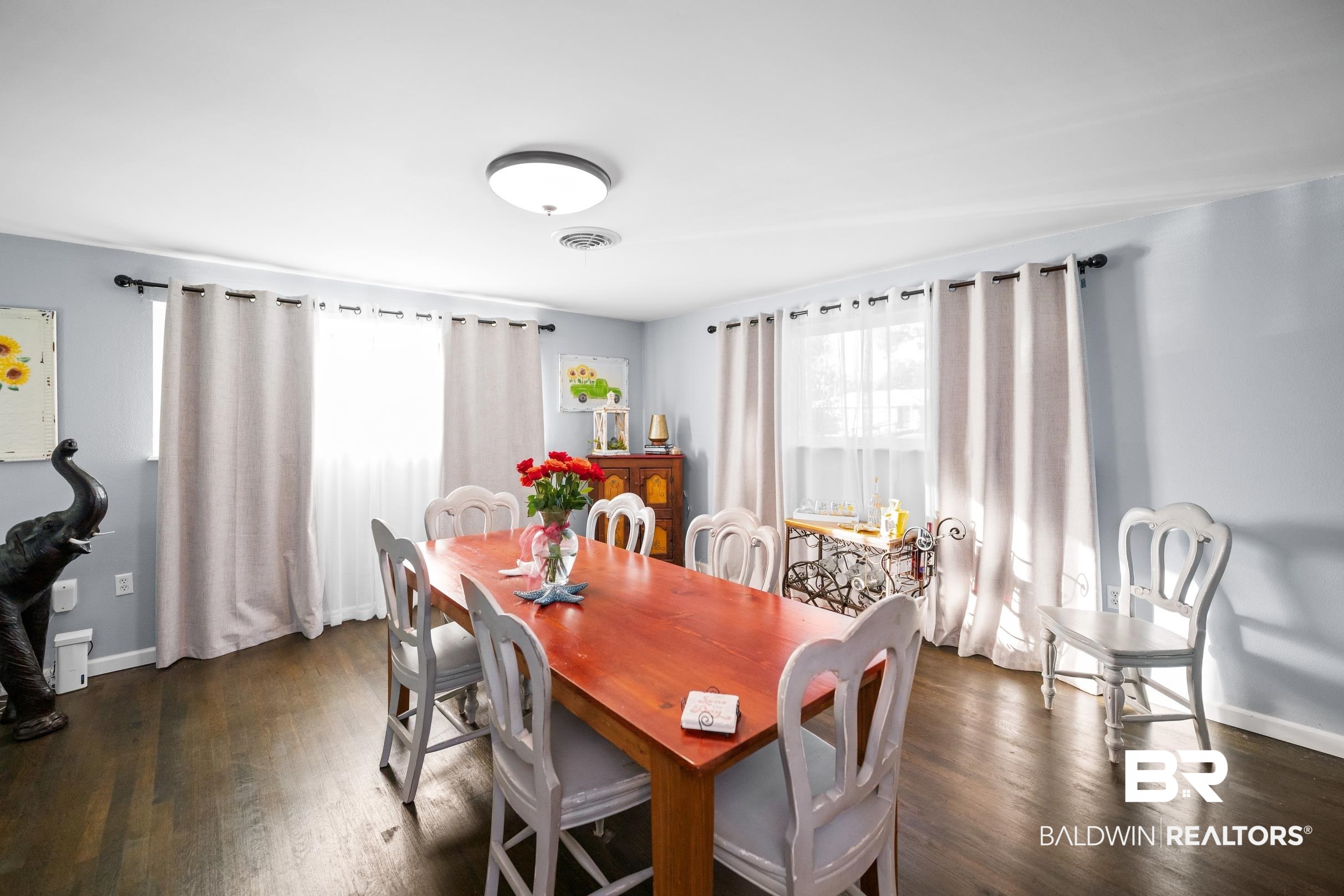 401 West Myrtle Avenue Foley, AL 36535 - Photo 8 of 39 Dining area with baseboards and dark wood-style floors