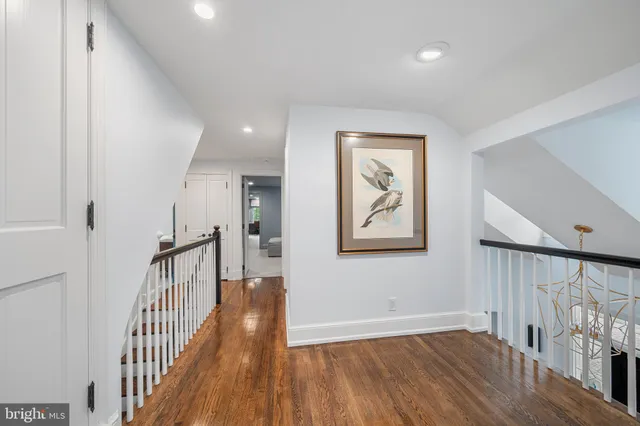 a view of hallway with wooden floor