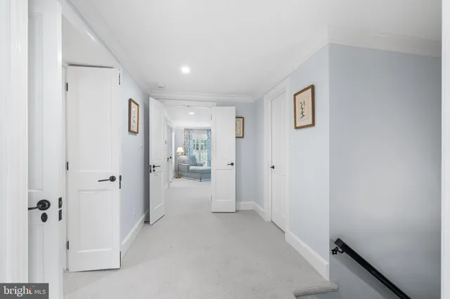 a spacious bedroom with a large bed and a window