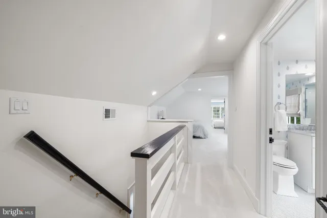 a view of hallway with livingroom and furniture
