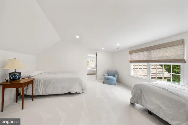 a view of room with furniture and wooden floor