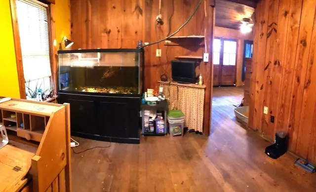 a living room with furniture and a flat screen tv