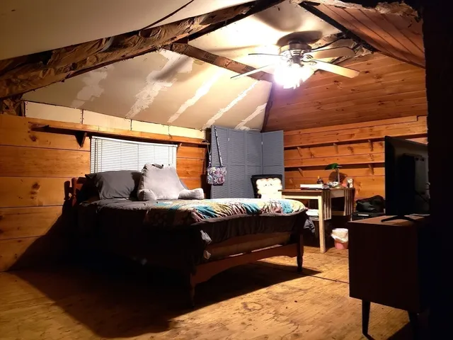 a bed room with furniture and a window