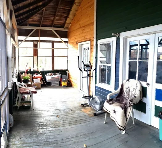 a living room filled with furniture and a window