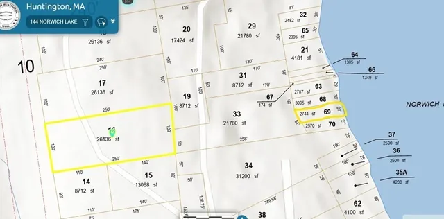 a white refrigerator sitting next to a white wall