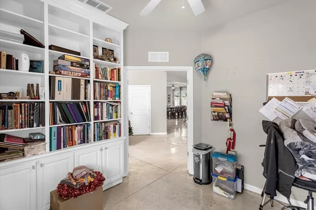 a room with furniture and book shelf