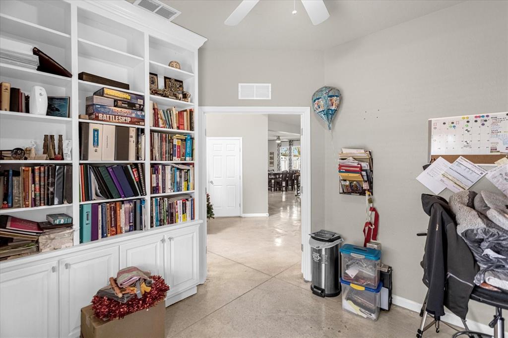 5781 Southwest 39th Street Ocala, FL 34474 - Photo 11 of 45 a room with furniture and book shelf