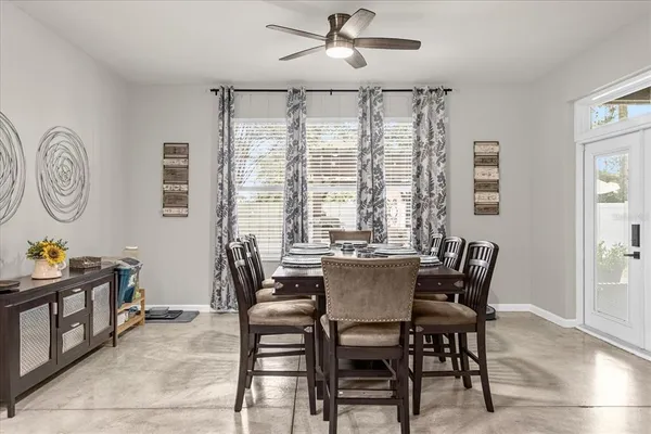 a dining room with furniture and window