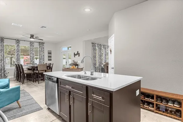 a view of dining table chairs and window