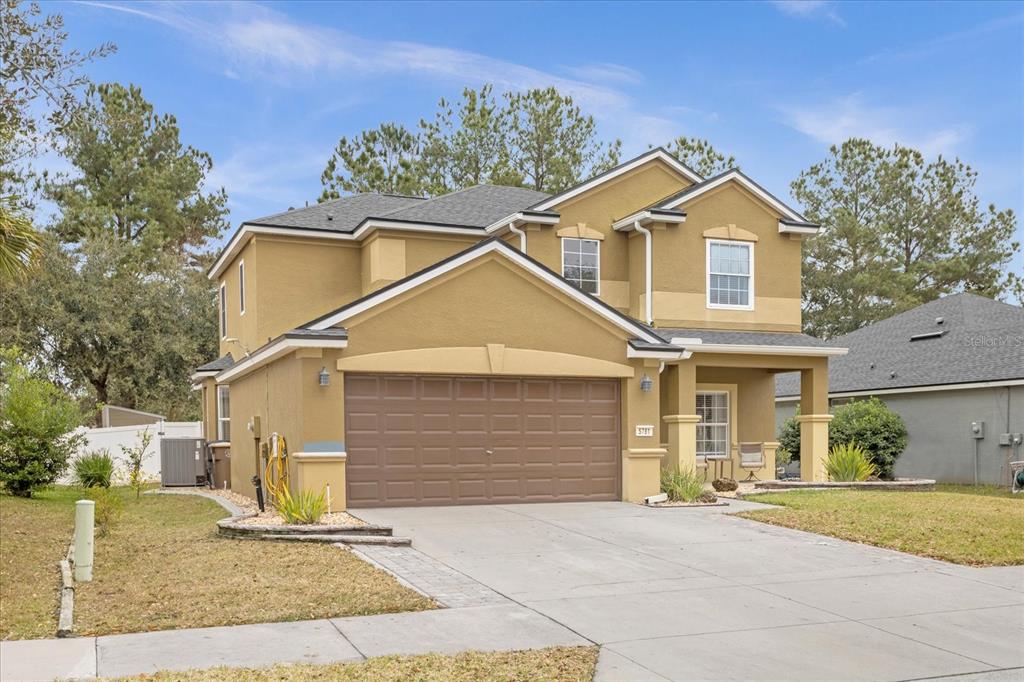 5781 Southwest 39th Street Ocala, FL 34474 - Photo 2 of 45 a view of a yard in front of a house