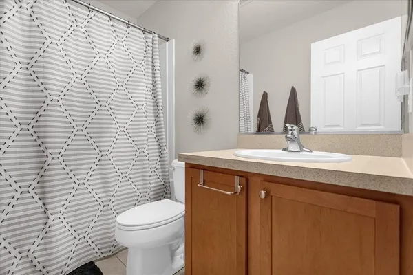 a living room with furniture a air conditioner and a window