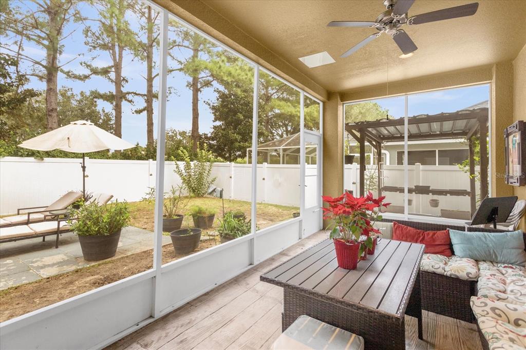 5781 Southwest 39th Street Ocala, FL 34474 - Photo 35 of 45 a view of a dining room with furniture window and wooden floor