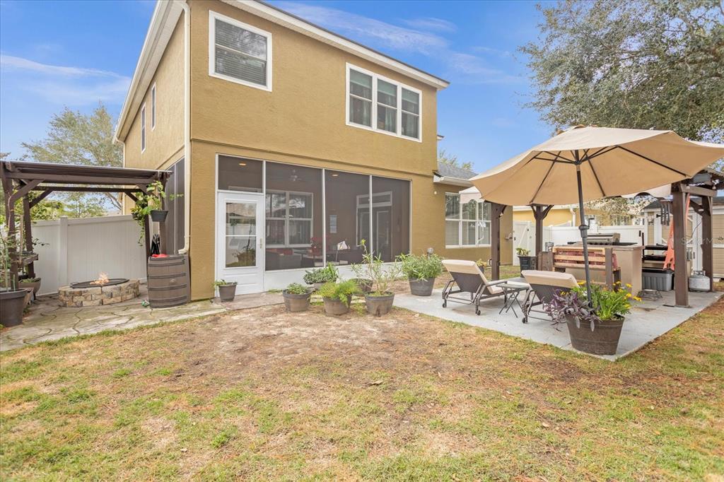 5781 Southwest 39th Street Ocala, FL 34474 - Photo 36 of 45 a view of a house with backyard and sitting area