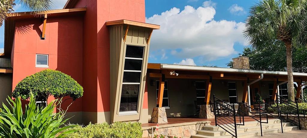 5781 Southwest 39th Street Ocala, FL 34474 - Photo 38 of 45 a front view of a house with garden